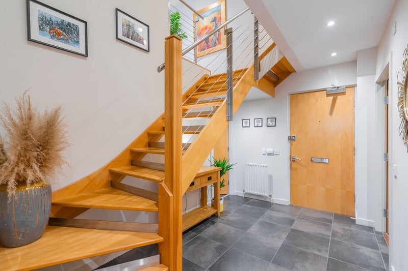 A spiral staircase leads you to the mezzanine level of the property