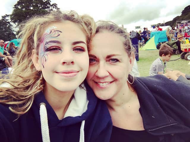 Lulu and her mum Carolyn at a festival.