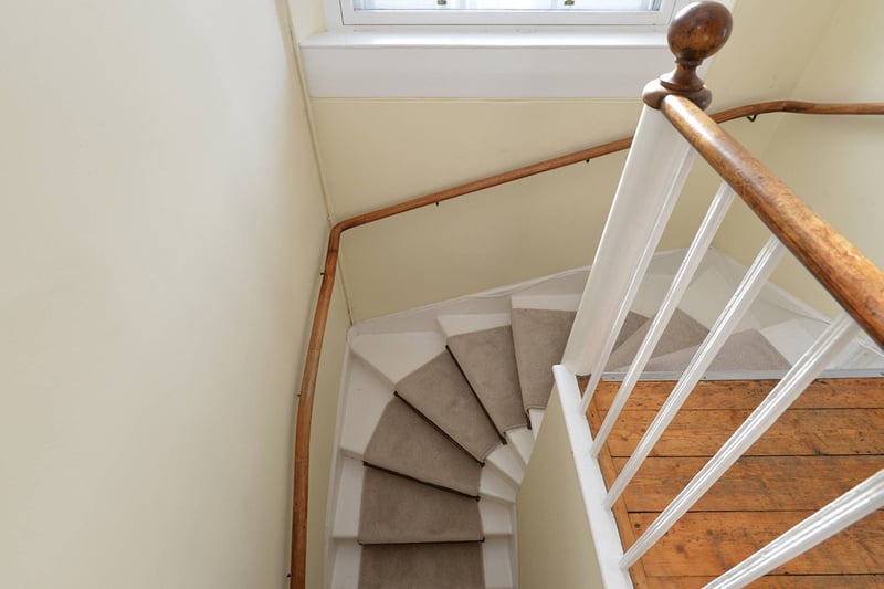 Climbing the stairs, a spacious landing gives access to the study, bathroom, and all three bedrooms.