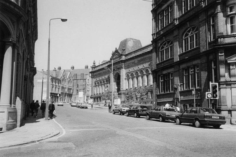 A view looking north along Cookridge Street from the junction with Great George Street. The Leonardo Building is seen on the right, formerly offices of Chorley and Pickersgill, printers, who had the Electric Press building across the road on the left. In 1975 the Leonardo Building became part of City of Leeds School; since 1998 it has been occupied by Leeds City Council. Further along, after the junction with Rossington Street, is the old Civic Theatre, formerly Leeds Mechanics Institute and since redeveloped as the new Leeds City Museum.