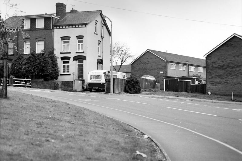 View looking towards Hall Lane from Green Lane, showing on the left a terrace of houses numbered 6 - 2 Hall Lane. Ice cream vans are parked in the yard of no. 2. On the right are houses on Hedley Green. Pictured in May 1988.
