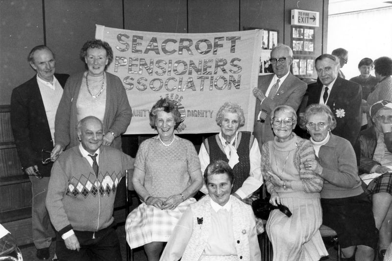 Members of Seacroft Pensioners Association at Seacroft Library where they had gathered for their weekly meeting. On this occasion they had invited Denis Healey MP to dedicate a new banner to be used as part of their campaign for increased pension. At this time the Seacroft Pensioners Association had been in operation for three years with meetings and outings held on Friday afternoons. The secretary was Mr. Fred Howard. The group displayed their banner during a City Centre march held on  March 30, 1988 when the pensioners taking part were addressed by the National President of the Pensioner's Associations, Jack Jones.