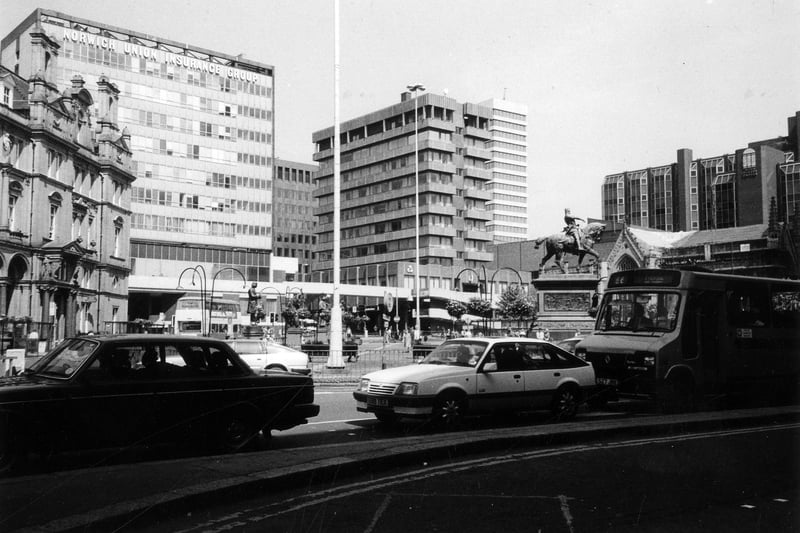 City Square from Wellington Street showing, from left, the General Post Office building, the Norwich Union Insurance Group offices then, after the junction with Park Row, the National Westminster Bank. On the right is Mill Hill Chapel with the top of the Bond Street Centre behind. The mounted statue of the Black Prince is also visible. In the background Lloyds Bank and West Riding House are seen on either side of the Nat West building.