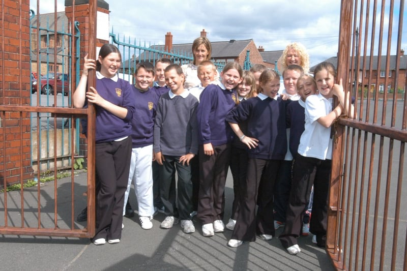 Year 6 pupils close the gates for the last time at St Hilda's RC School, Southwick in July 2004.