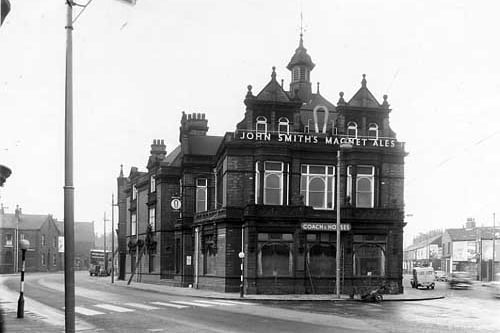 The John Smith's owned Coach and Horses public house was located at the junction of Beeston Road (left) and Elland Road (right). The landlord was Walter Spence and it was listed as number 2 Beeston Road. Pictured in April 1959.