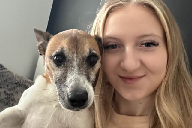 Ellie Chapman, 20, with her dog Ozzy that can 'say her name'. Picture: Ellie Chapman / SWNS