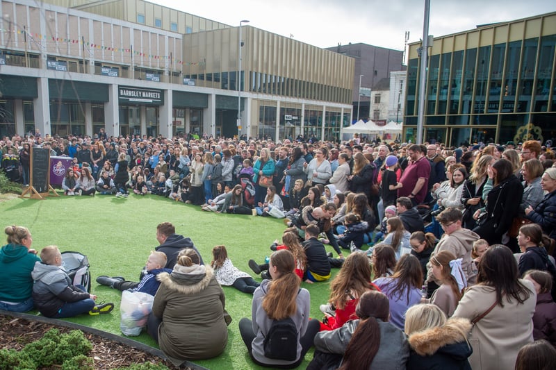 A crowd of hundreds of people circled outside The Glass Works shopping centre to watch the performances. Photo credit: Charley Atkins