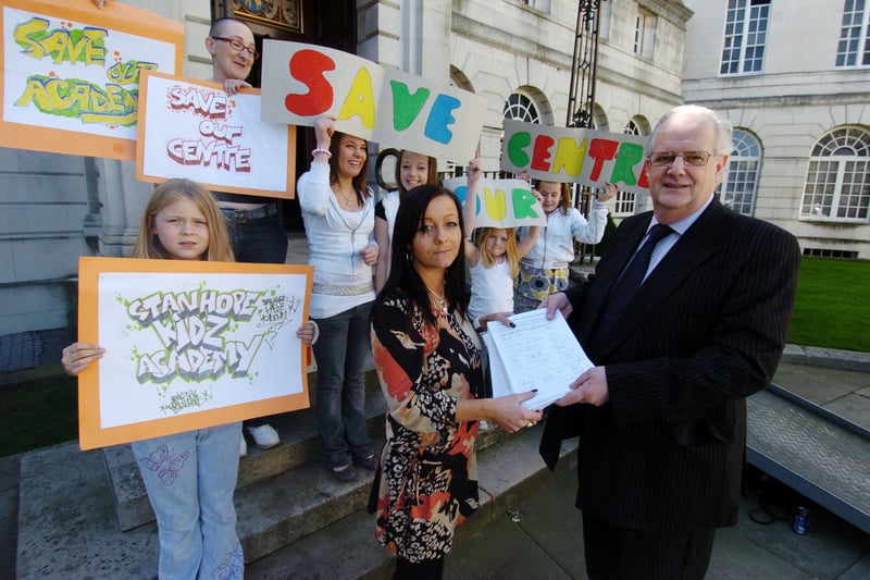 Coun Andrew Carter receives a petition from Louise Johnson  with youngsters hoping to save Stanhope Community Centre in Horsforth in April 2007.