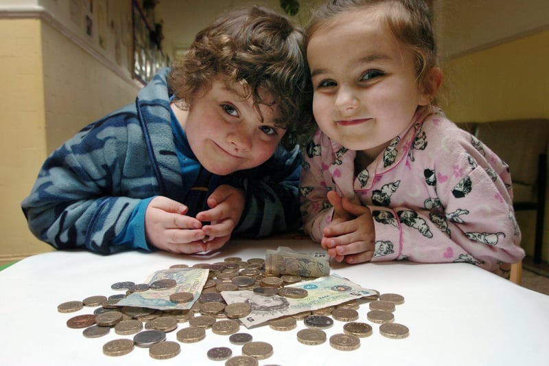 Pupils and staff at Featherbank Infants School dressed in pyjamas to raise money for charity in February 2007. Pictured are pupils Hudson Morgan, left, and Ceri Bullock with the money raised..
