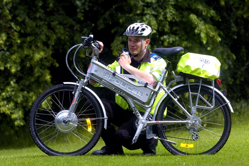 June 2007 and PCSO James Crowther tries out one of West Yorkshire newest forms of transport - an electric bicycle in Horsforth Park.