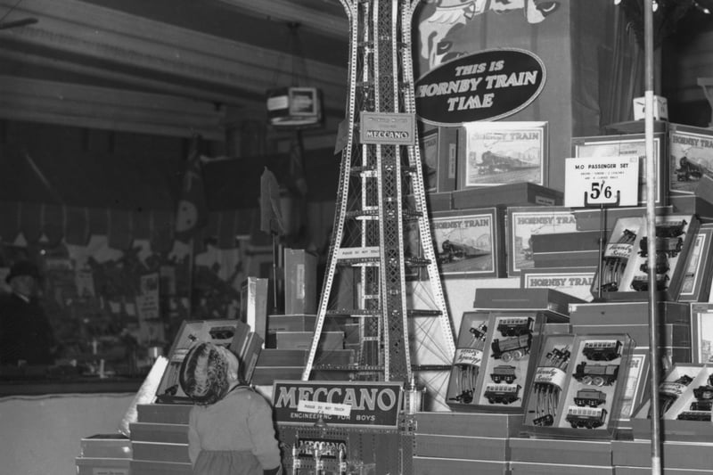 A youngster examines a Meccano model of Blackpool Tower in a toy store in Manchester, 13th December 1936