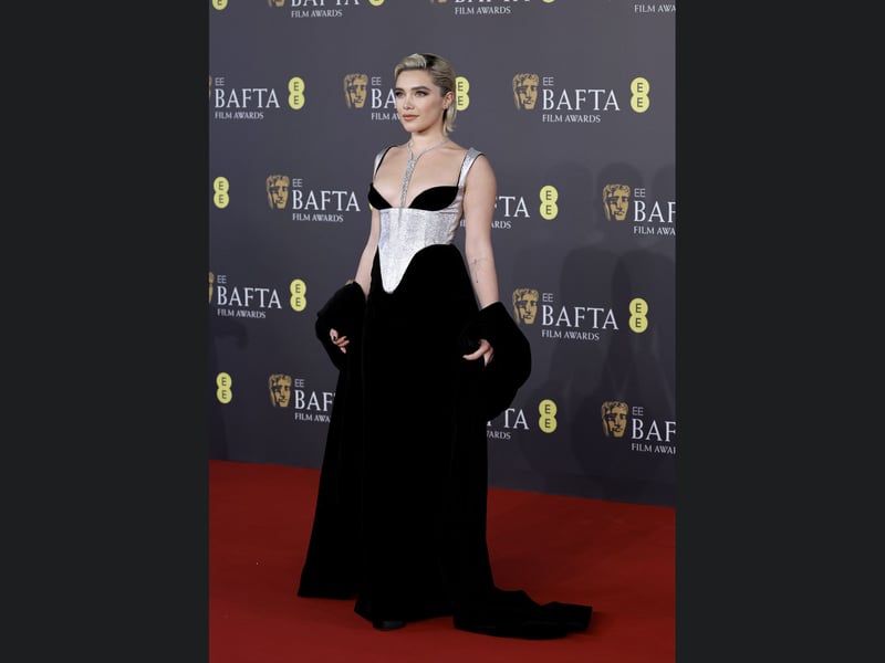 Florence Pugh poses on the 2024 Bafta red carpet.