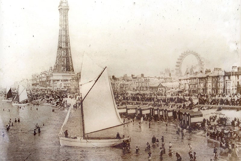 An early picture of Blackpool which shows a busy beach and seafront