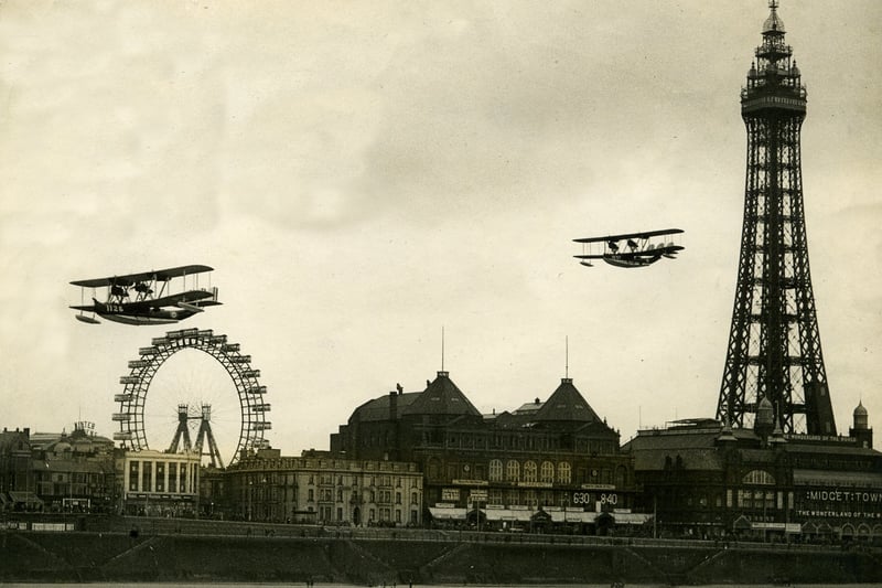 The tower's prominence as flying boats soar over North Pier in the 1920s