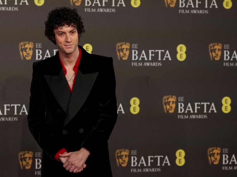 Dominic Sessa, from The Holdovers, posing on the Bafta red carpet.