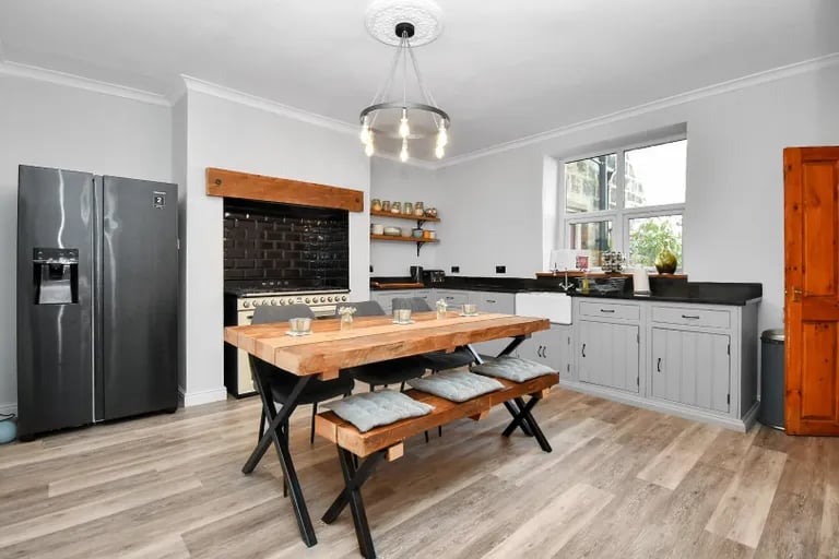 The dining kitchen features Indian rosewood units, granite worktops and has lots of space for a large dining table.