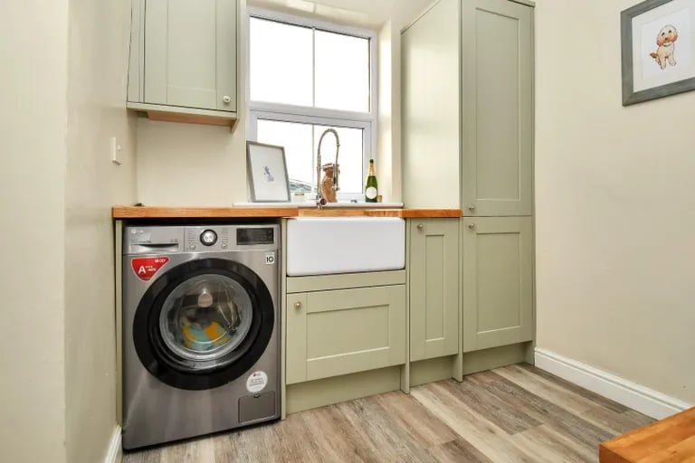Behind the kitchen sits a handy utility room with access the rear garden and basement where two additional rooms can be found.