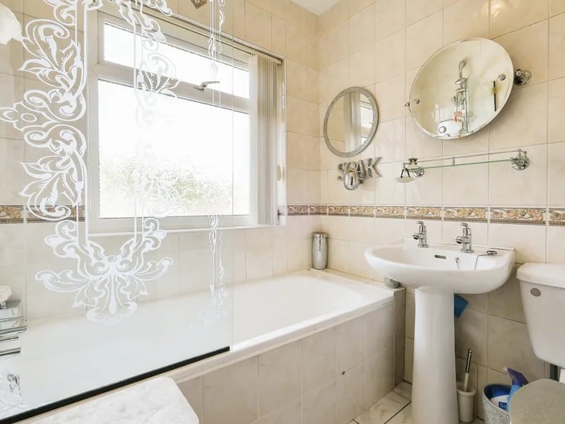 A fully tiled house bathroom, a modern and stylish space for relaxation, completes the living accommodation. 