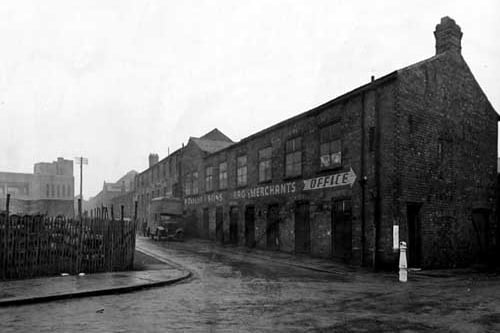 Byron Street Mills on Millwright Street in January 1945. P. Taylor, rag merchants, is in the foreground, where a man stands beside a van.