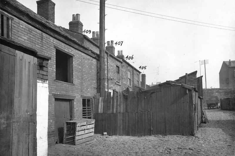 Buildings in a yard off York Road, possibly Joy's Fold near the junction with Marsh Lane. The area was scheduled for improvement with a lot of buildings demolished as part of the slum clearance programme. Pictured in September 1933.