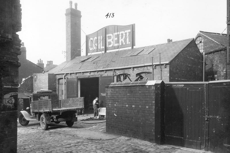Joy's Fold, a yard off York Road near the junction with Marsh Lane. In the centre are the premises of Cecil Gilbert, shoeing smith, of no.15 Joy's Fold. These buildings were all soon to be demolished as part of the slum clearance programme in the area. Pictured in September 1935.