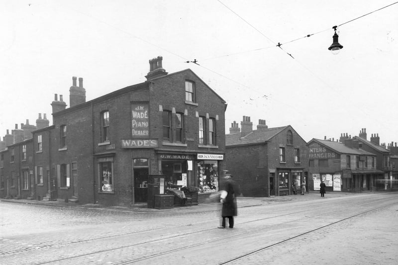 Premises on the south side of York Road due for demolition as part of slum clearance of the area. On the left is the junction with Upper Accommodation Road then no.72 formerly J.W. Wade, furniture and piano dealer and no.70 Jack Nimon, clothier. Next is the junction with Oak Street then further along Elm Street. Pictured in September 1938.