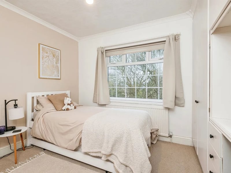 Another good-size double bedroom overlooks the rear garden.