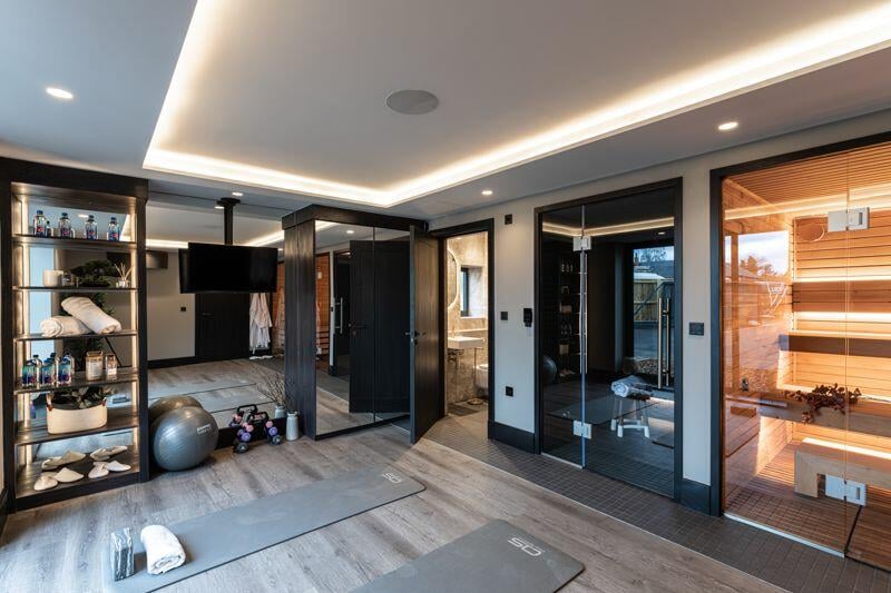 Described as a "luxury wellbeing suite", the property has a home gym space, steam room and sauna.