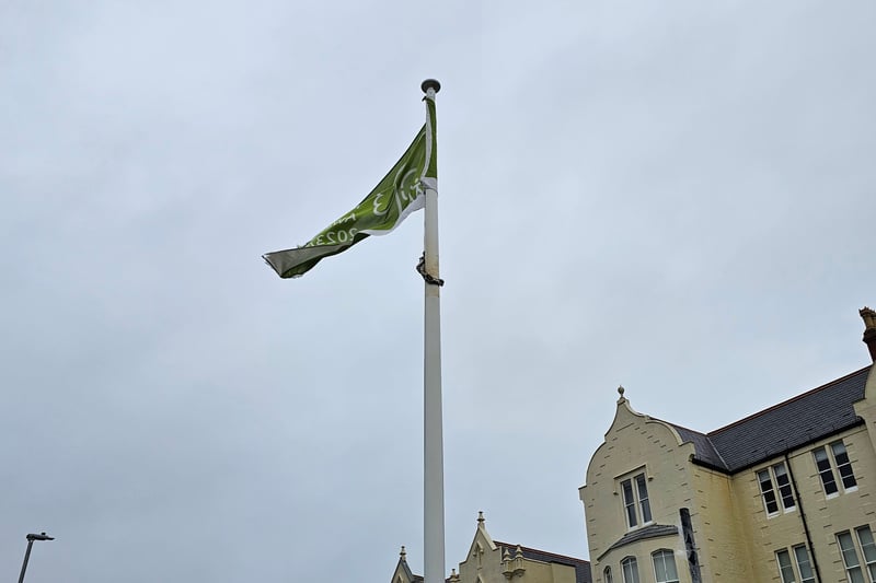 A flag pole has always been a prominent feature of the area, including when the area was known as Flag Staff Hill and was used as a point of navigation for passing ships, in the 1860s when it was upgraded into a commercial pleasure ground and in 1893 when it became a public garden. The current pole was installed in 2016 in memory of the legacy.