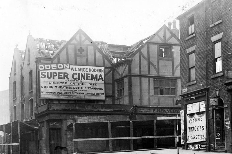 The Old Hall Hotel on Wade Lane during demolition. This had closed in 1937 and, as can be seen from the sign, there were plans to build an Odeon Cinema on the site. However after demolition the site was used for a car park until the early 1960s when the Merrion Centre was built. An Odeon cinema did open in the centre in August 1964 and closed on October 30, 1977. Merrion Street is in the foreground of the photograph.