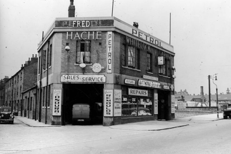 Fred Hache's Whitelock Garage at corner of Sheepscar Street and Whitelock Street. The back of a van can be seen parked inside the repair bay. To the left can be seen terraced houses on Whitelock Street. Pictured in July 1946.