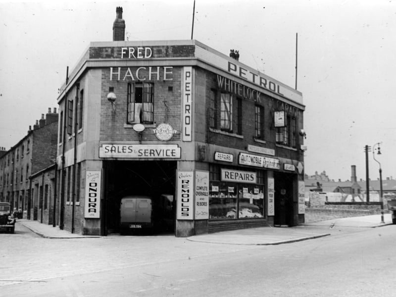 Fred Hache's Whitelock Garage at corner of Sheepscar Street and Whitelock Street. The back of a van can be seen parked inside the repair bay. To the left can be seen terraced houses on Whitelock Street. Pictured in July 1946.