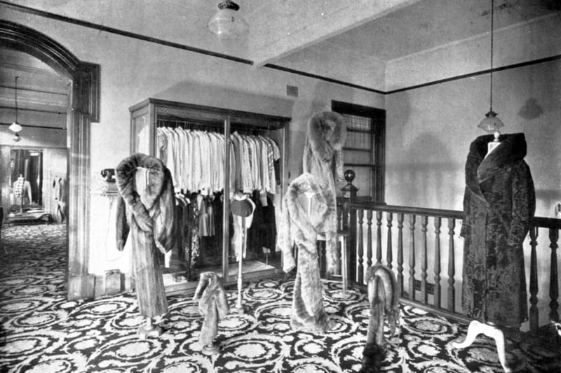 JR Taylor 's fur salon on the first floor in 1916. Private fitting rooms were through the archway on the left
