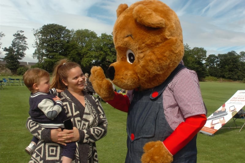 Oakley the Bear met Louise Blakie and Harry Longstaff at the Grace House fun day in Thompson Road, in 2016.