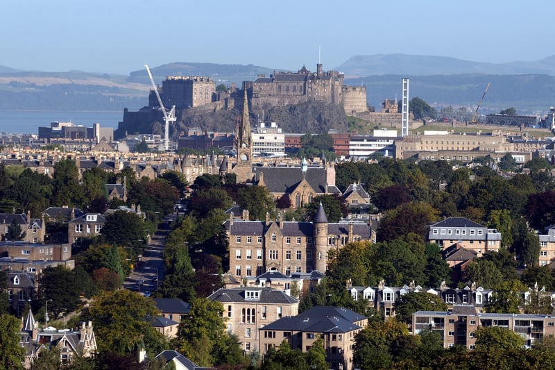 Taken in September, 2002, this is a great aerial photo of Edinburgh Castle and the Old Town looking north towards Fife, with the Meadows in the foreground.