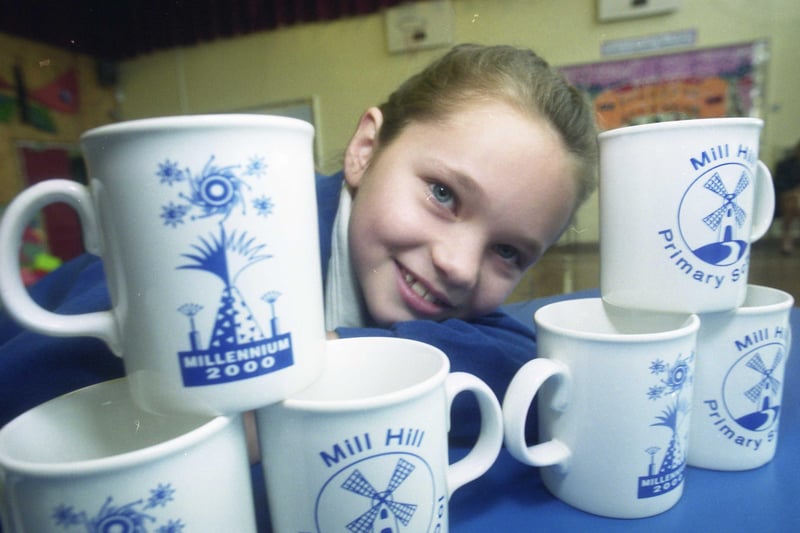 The school handed out over 600 commemorative mugs in  2000 to mark the millennium.
Here is Christy Sanderson, 10, from the school with some of the gifts for staff and pupils.