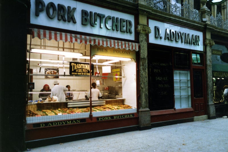 The shop window of pork butcher Dearlove Addyman  on Queen Victoria Street pictured in October 1989. The walkway was between Queen Victoria Street, left and the County Arcade. On the right is Goldsmith at number 23 County Arcade. These shops were about to be restored to their former glory as part of the scheme for the Victoria Quarter.