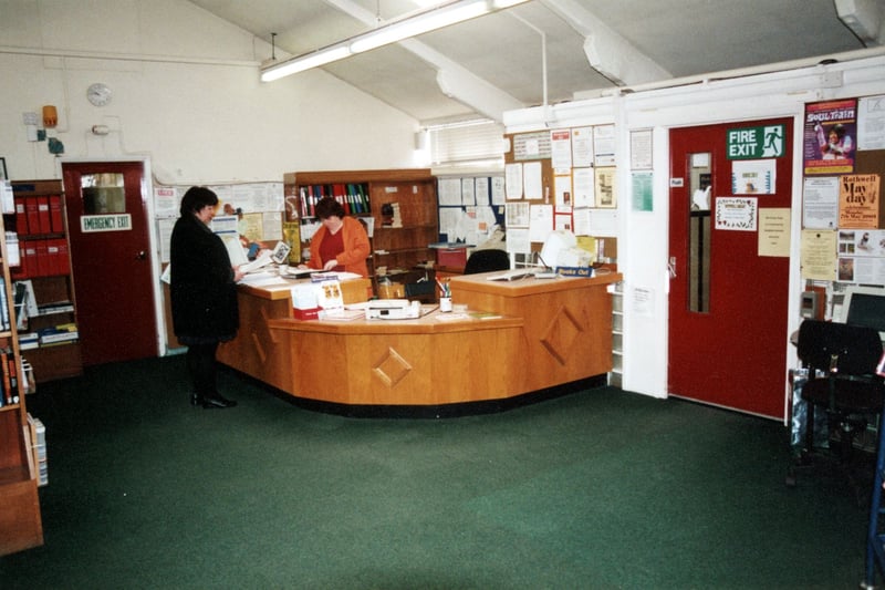 The counter area in the old Rothwell Library. The door on the right surrounded by notice boards leads into the Library. The door on the left marked ' Emergency Exit' leads to the Staff Offices, tea room and facilities. This photo was taken prior to closure in June 2001 in order for the site to be cleared and a new library building put up and opened in March 2002.