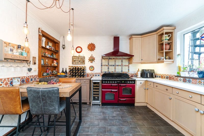 The quaint fitted breakfasting kitchen with utility room