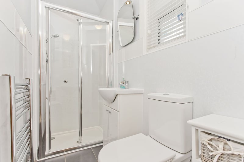 The handy downstairs shower room, with a walk-in shower cubicle and WC.