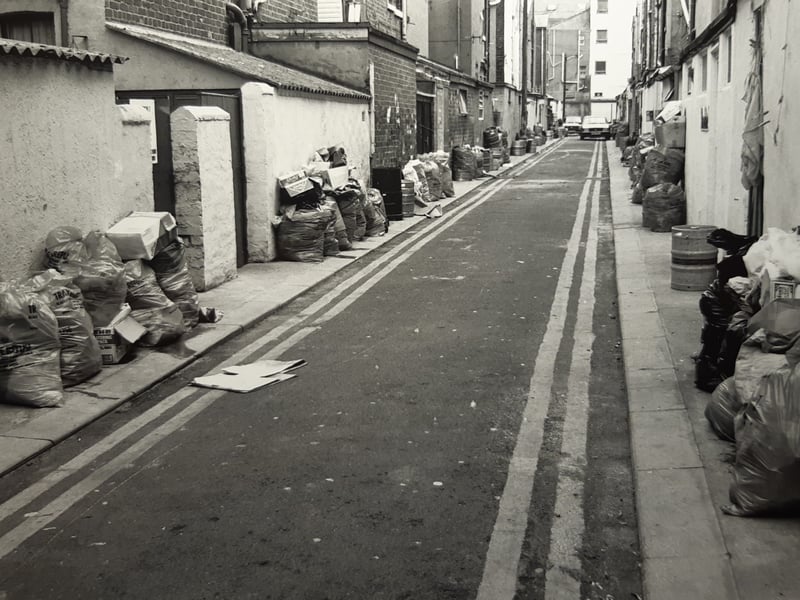 Bin bags piled high in an alleyway off Hull Road