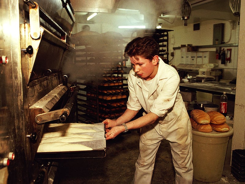 Picture shows a man baking bread in the early hours of the morning in a Glasgow bakery in March 1990.