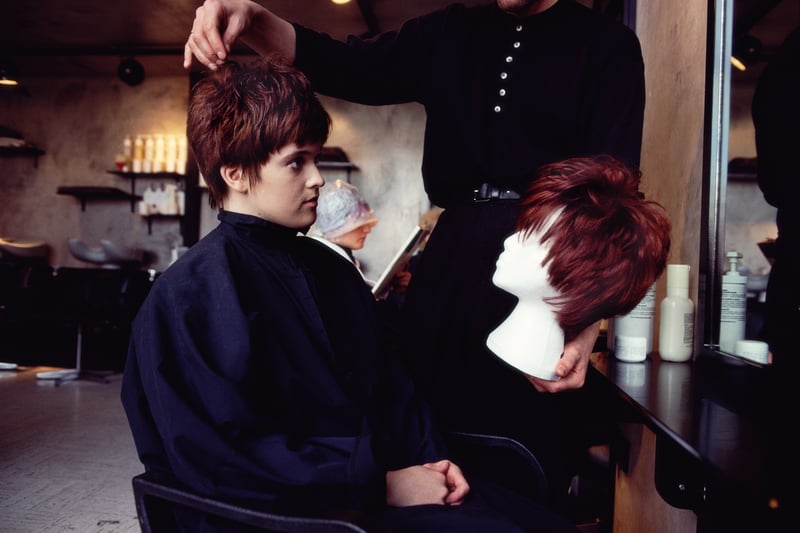 Getting the latest hair style at the salon in March 1990.