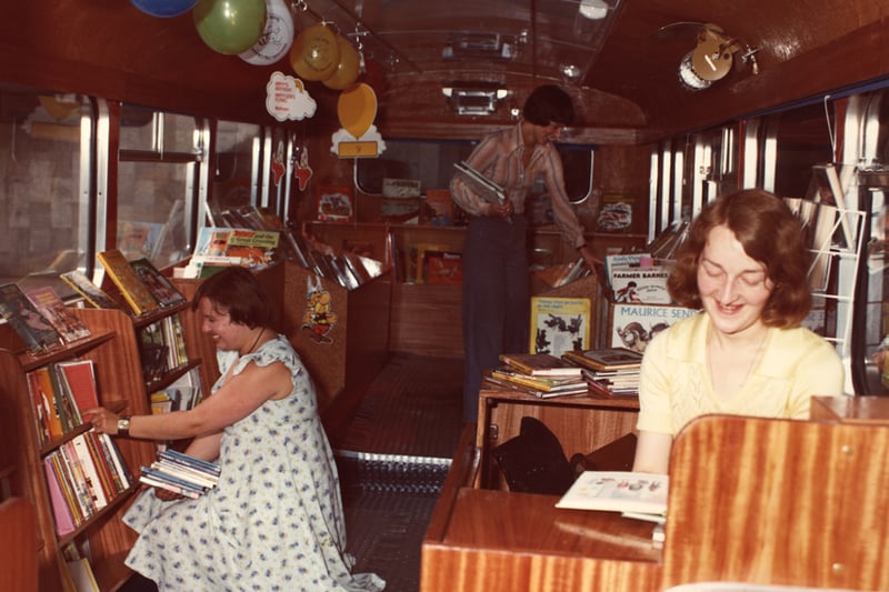 A view of the interior of the Book Bus Central Library Princess Square Newcastle upon Tyne taken in 1977. The photograph shows members of library staff Anne Tilling, Barbara Heathcote and Dilys Harding.