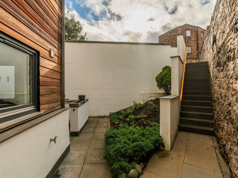 Exterior: Unusually for a city-centre property, this home features a rear paved seating area, which is easy to maintain and bordered by hedges.
Contact Neilsons