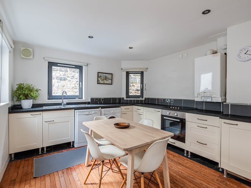 Interior: The main accommodation includes a spacious lounge with double doors opening to a rear garden, and a separate kitchen. On the first floor are the three double bedrooms that are well illuminated thanks to cleverly placed windows.