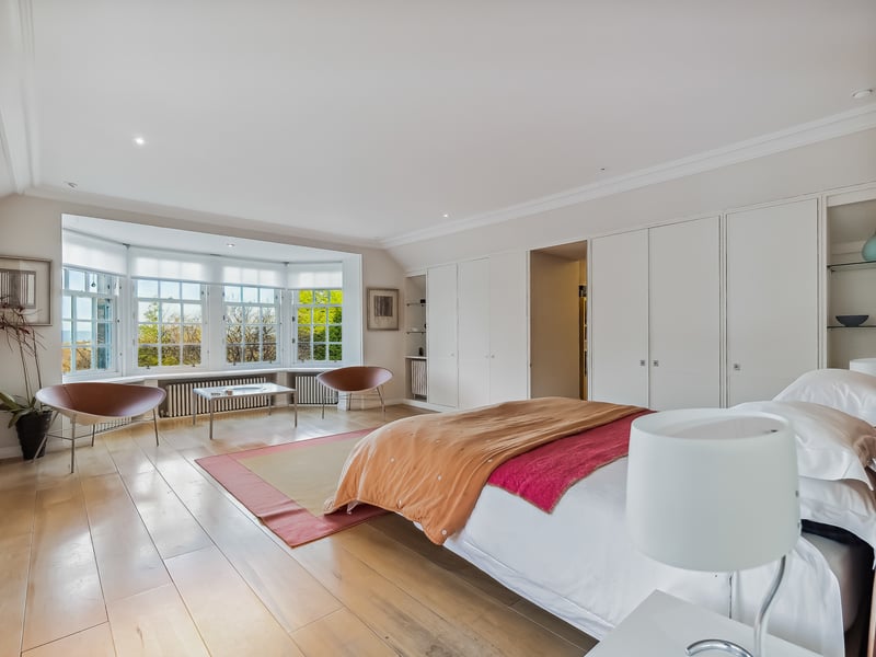 There are two wide staircases leading to the home’s airy first-floor hallway, which leads to a delightful terrace via French doors, with a separate reading nook in the turret.
A rear fourth ensuite bedroom could make a stand-alone suite, while each of the first-floor bedrooms offer ample storage space.