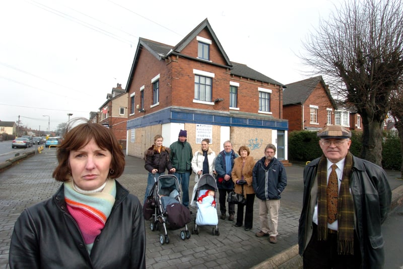 Crossgates Watch Residents Association were unhappy about plans to open a fast food take-away in building on Austhorpe Road in March 2006. Pictured, front, are Nicola De Whytell  and chair Eamonn Judge, and local residents.
