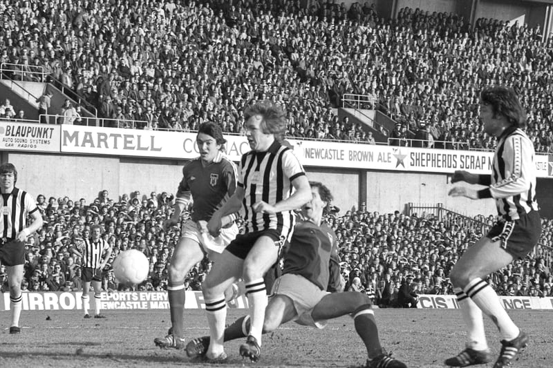 Newcastle United defender John Blackley passes back while being challenged by Sunderland's Bob Lee (left) and Gary Rowell.