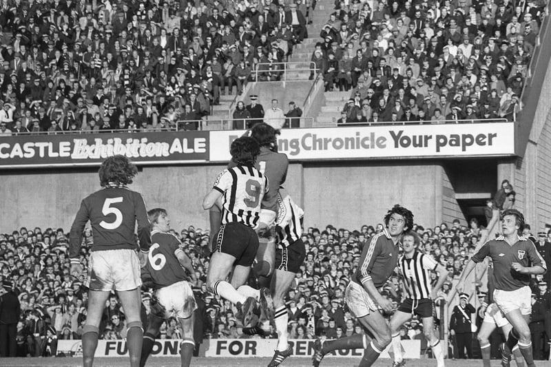Barry Siddall gathers the ball ahead of Newcastle United striker Peter Withe.